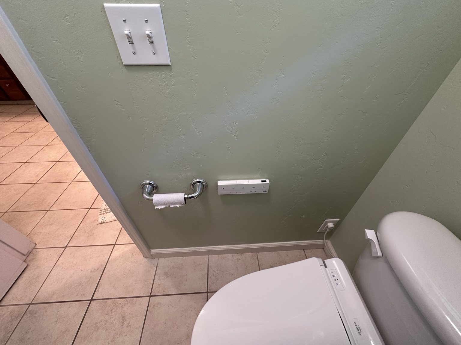 Bathroom after powered bidet and nearby power connection installation