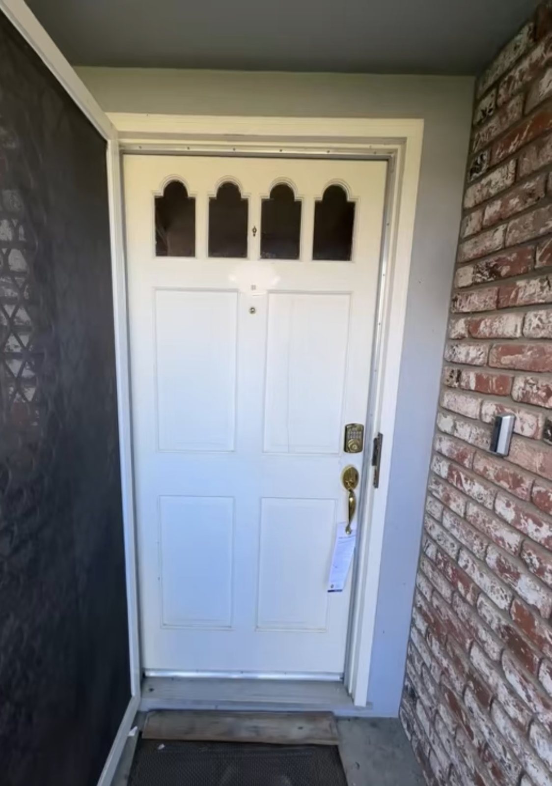 Older exterior entry door before replacement