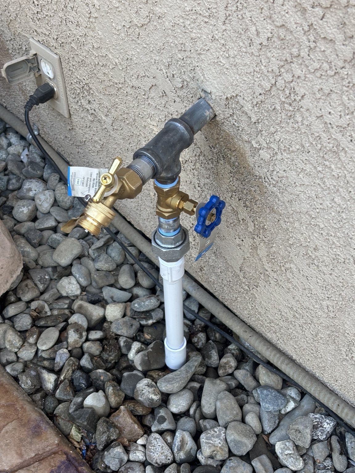 New brass hose bib and shutoff valve after replacement